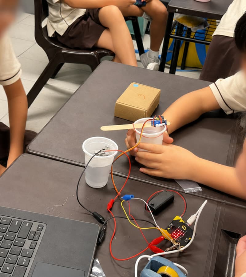 Students working on plant prototypes in a Singapore classroom